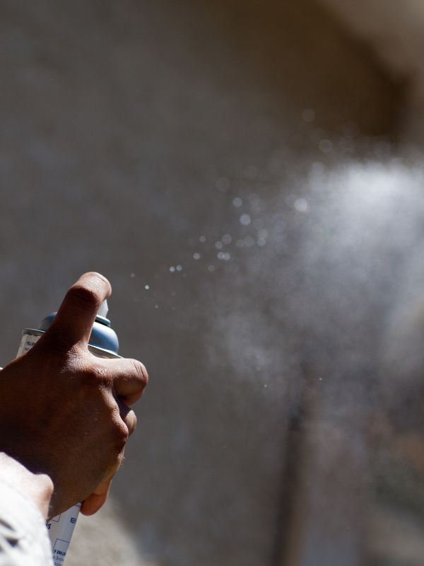 man hand applying repellent at air roanoke tx